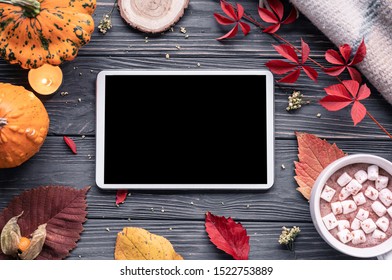 Autumn Fall Holiday Background With Pumpkin Orange Leaves Cocoa Cup Tablet Computer Blank Empty Screen Mock Up On Brown Wooden Table Happy Halloween Thanksgiving Shopping Sale Above Top View