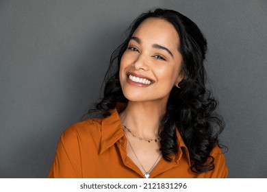 Close Up Face Of Young Woman With Beautiful Smile Isolated On Grey Wall With Copy Space Successful Multiethnic Girl Latin Woman Looking At Camera Against Gray Wall With A Big Whitening Teeth Smile