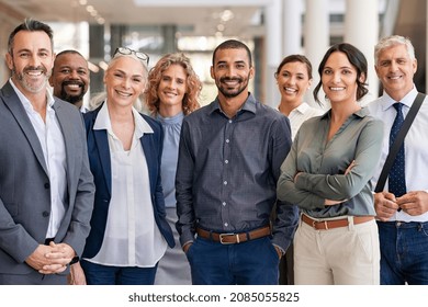 Portrait Of Successful Group Of Business People At Modern Office Looking At Camera Portrait Of Happy Businessmen And Satisfied Businesswomen Standing As A Team Multiethnic Group Of People Smiling