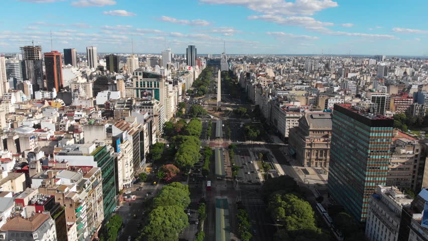 Panoramic Aerial Drone View Of Buenos Aires Obelisk On Avenida De Julio In Buenos Aires Argentina Shows Buildings And Skyscrapers With Car Traffic In The Street Below