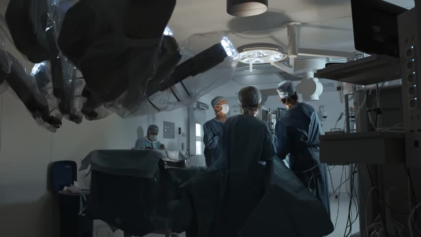 Operating Room Team Of Surgeons Prepares Patient To Cancer Removal Surgery Via Minimally Invasive Robotic Surgery Hi Tech Medical Robot Modern Medicine Futuristic Medical Equipment Operation