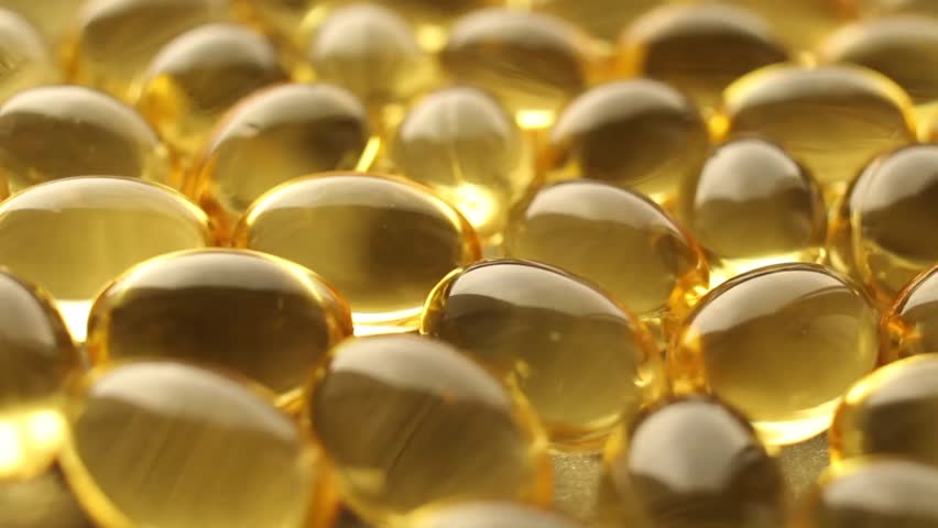 Omega 3 Gold Fish Oil Capsules Rotation Background Macro