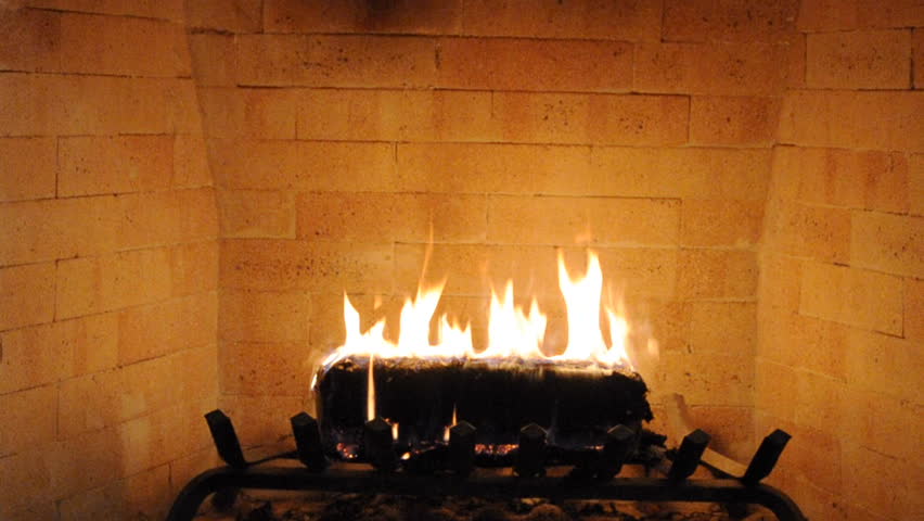 Brick Fireplace Closeup With Log Burning