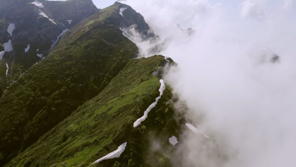 Drone Flying Over The Mountain Peak