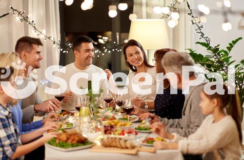 Celebration Holidays And People Concept   Happy Family Having Dinner Party At Home