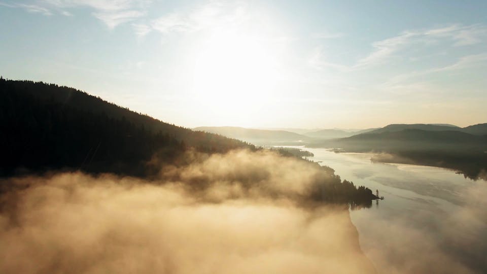 Drone Footage Of The Thick Fog On A Mountain Forest