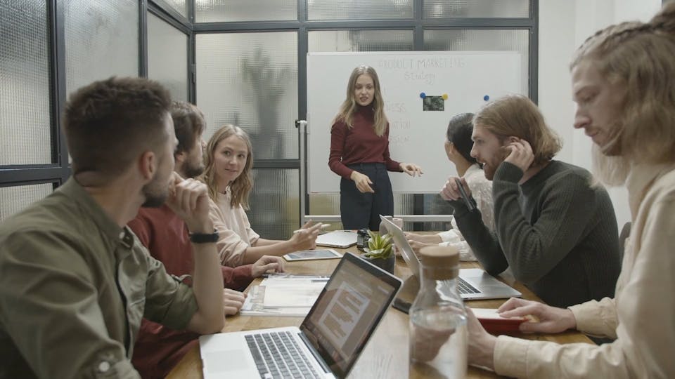 People In A Conference Room For A Business Meeting