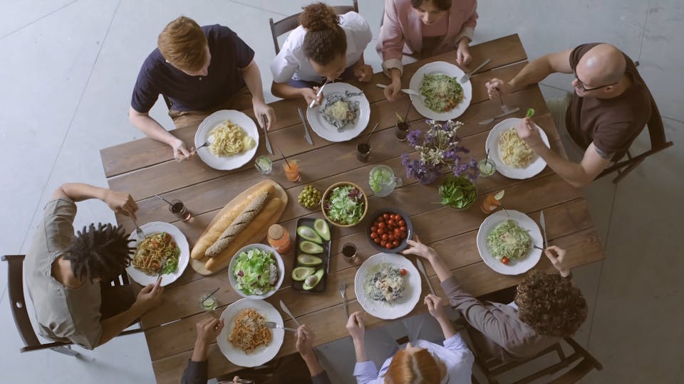 Group Of People Eating Together