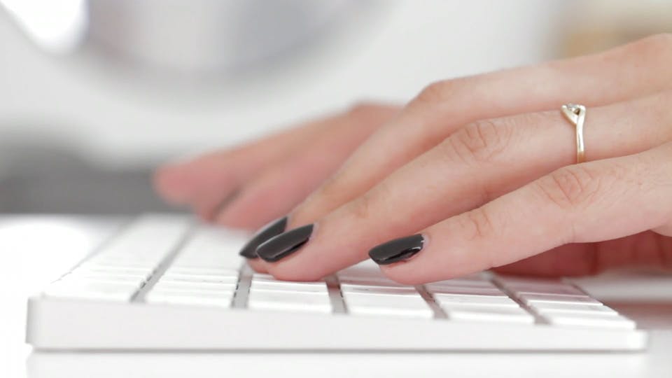 White Keyboard And Black Painted Finger Nails