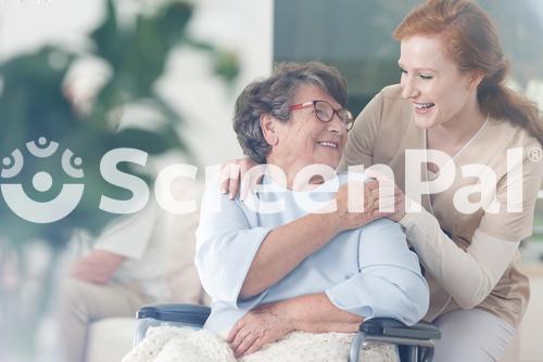 Happy Patient Is Holding Caregiver For A Hand While Spending Time Together