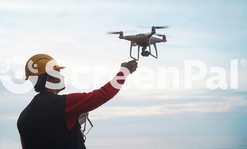 Man Engineer Flying With Drone   Video Surveillance And Industrial Ispection Concept   Focus On Hand