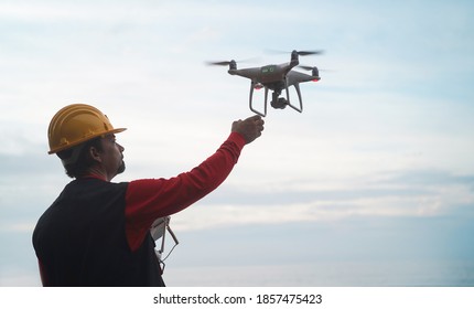 Man Engineer Flying With Drone   Video Surveillance And Industrial Ispection Concept   Focus On Hand