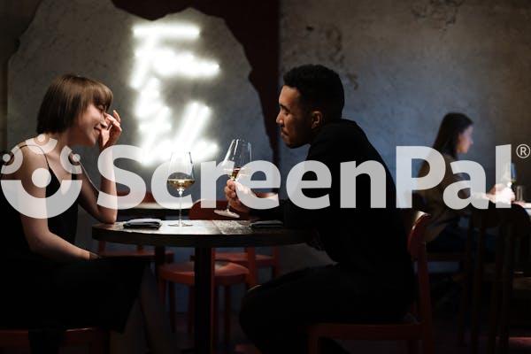 Man In Black Long Sleeve Shirt Sitting On Chair