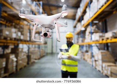 Man With Drone In A Warehouse