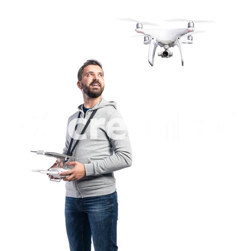 Man With Flying Drone Studio Shot On White Background Isolated