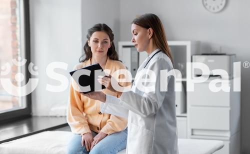 Medicine Healthcare And People Concept   Female Doctor With Tablet Pc Computer Talking To Woman Patient At Hospital