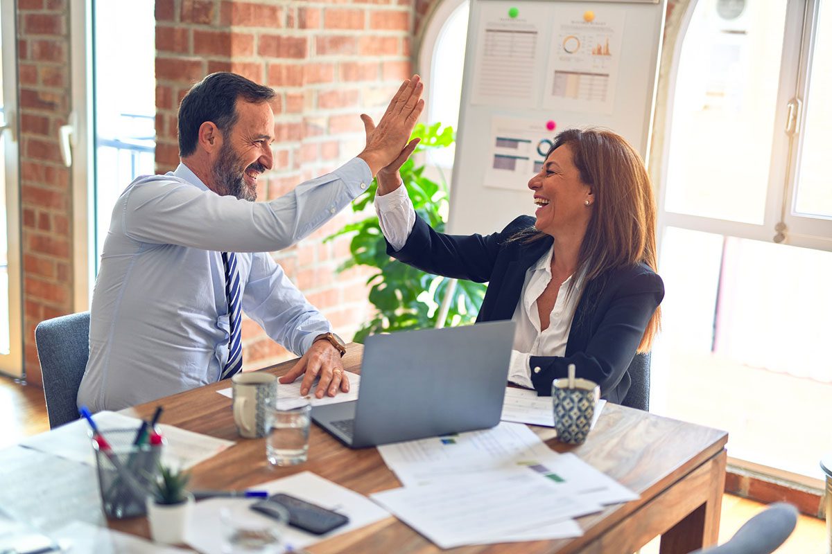 office-two-people-high-five