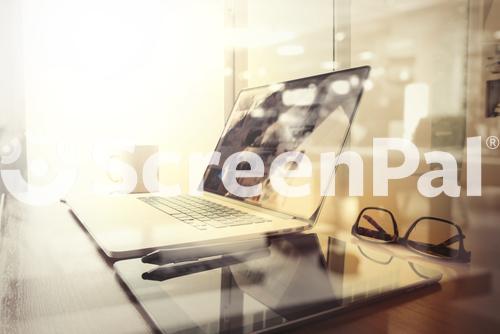 Office Workplace With Laptop And Smart Phone On Wood Table And London City Blurred Background  