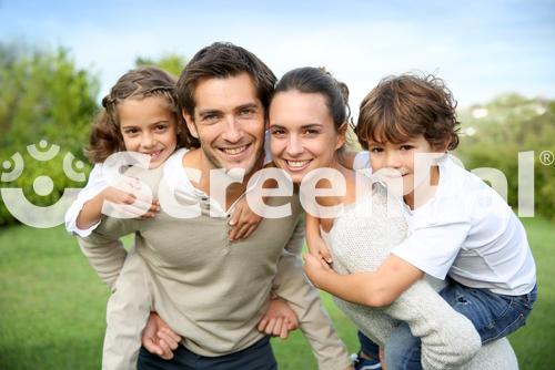 Parents Giving Piggyback Ride To Children