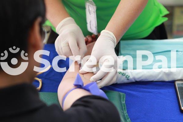 Person Getting His Blood Check