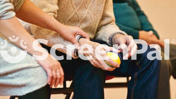 Person Holding A Stress Ball