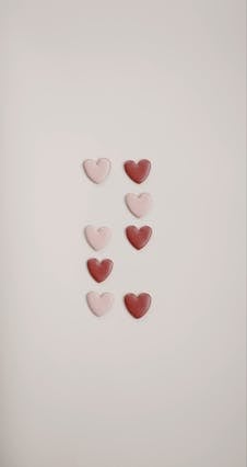 Woman Arranging Small Hearts