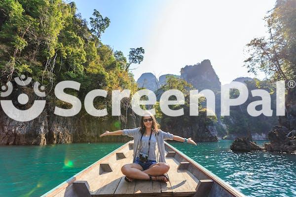 Photo Of Woman Sitting On Boat Spreading Her Arms