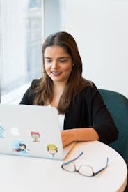 Photography Of A Woman Using Laptop