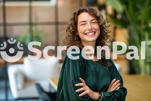 Portrait Of Young Smiling Woman Looking At Camera With Crossed Arms Happy Girl Standing In Creative Office Successful Businesswoman Standing In Office With Copy Space