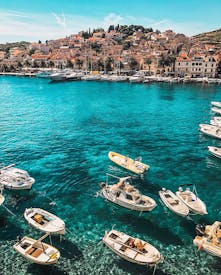 White Boats On Body Of Water