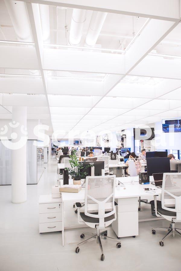 White Plastic Chairs And Tables In White Room